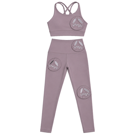 GOOUNIES mauve crop top and leggings set with circular embroidered face patches.