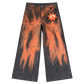 Front view of GOOUNIES orange and charcoal wide-leg jeans with an orange face patch