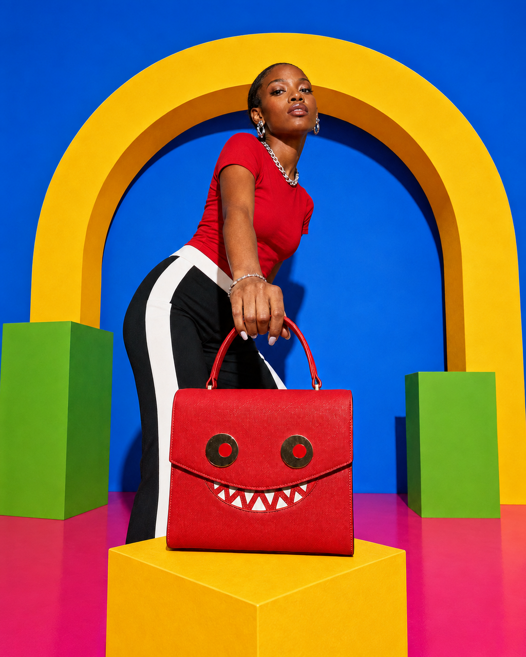 Model carrying the GOOUNIES red statement bag